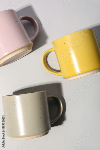 Different ceramic mugs on w...