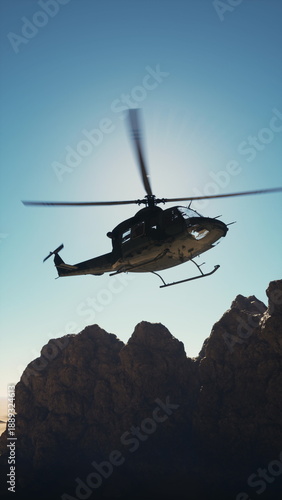 Wallpaper Mural An old American military retro helicopter flying over a rocky mountain range on a clear day. Torontodigital.ca