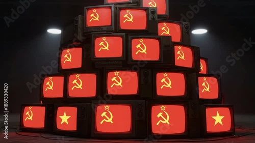 Pile of vintage televisions displaying hammer and sickle symbol, symbolizing propaganda