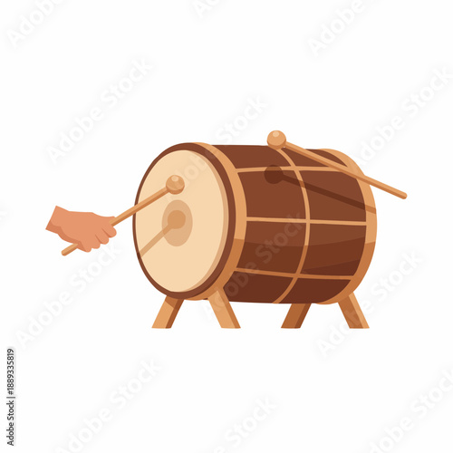 Traditional brown wooden Dholak drum with drumsticks and hand playing