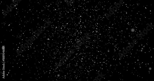 Isolated falling snow. Moving banner with falling snowflakes, winter snowfall and white snow particles on dark alpha channel background. Realistic graphic animated footage