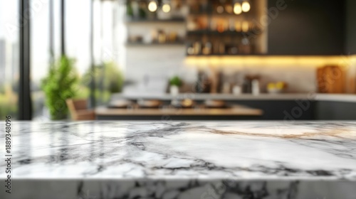 Elegant marble countertop in a modern, blurred kitchen setting with a hint of green plants