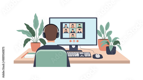 Virtual meeting in home office setting with person wearing headphones and monitor displaying video call