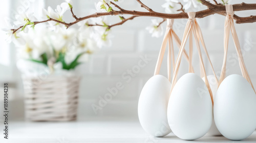 Spring welcome with minimalistic decorative branches and hanging eggs for easter display