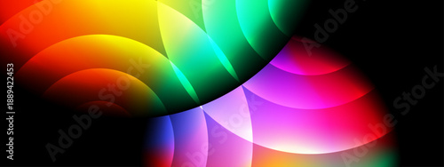 A vibrant composition of colorful intersecting circular light beams on a solid black background for high impact design