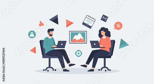 Two individuals collaborating on laptops focused on work and teamwork.