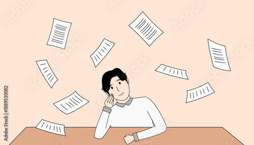 Man sits at a table with a pile of papers in front of him