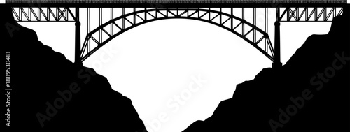 Massive steel arch bridge spanning gorge silhouette