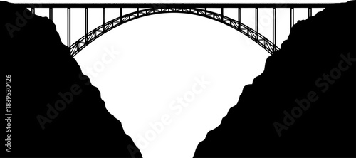 Massive steel arch bridge spanning a deep mountain canyon