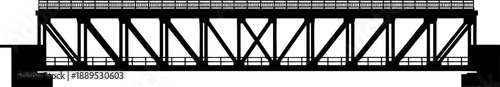 Long industrial metal girder bridge silhouette with safety railings