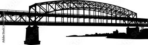 Large steel arch bridge silhouette with city skyline background