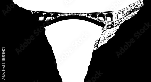 High arch bridge spanning deep canyon silhouette