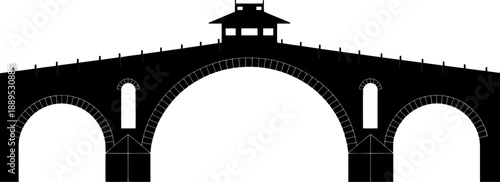 Grand stone bridge with pavilion gatehouse silhouette