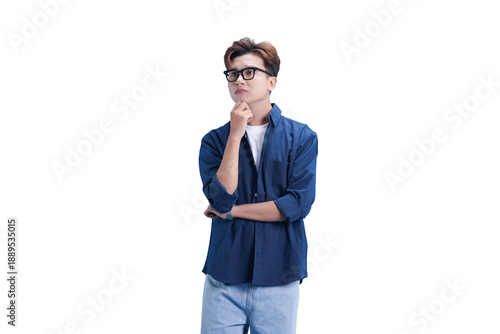 Konstfotografi Man in Deep Thought: A young man, wearing stylish glasses, stands deep in contemplation, his expression reflecting thoughtful consideration, capturing a moment of introspection and mental focus