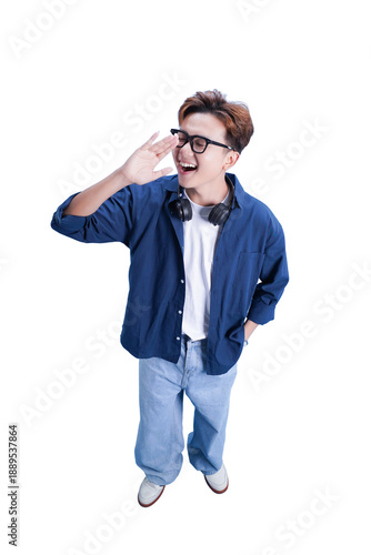 Canvas Print Enthusiastic Announcement: A young, vibrant individual, adorned in a casual denim shirt and eyeglasses, radiates pure energy as they extend a hand, expressing elation and enthusiasm