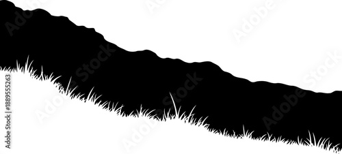 Grassy hillside slope silhouette against a clear sky