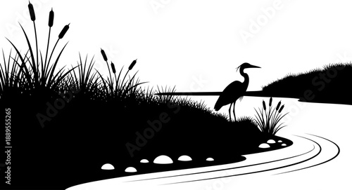 Heron bird silhouette standing in a marshy riverbank