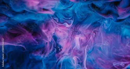 Paint splash. Ink mist. Defocused blue purple color glitter cloud pigment texture sparkling particles spreading on abstract art background.