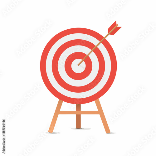 A red target with a wooden arrow hitting the bullseye standing on a tripod