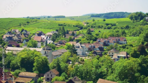 Charming French village surrounded by green hills and vineyards near Ribeauville, France