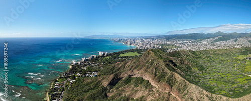 Aerial panorama of Honolulu Waikiki Beach from distance, Diamond Head Mountain famous lookout point in the foreground