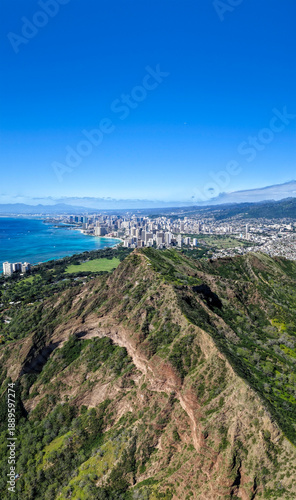 High angle view of Diamond Head Mountain famous lookout point in Honolulu, Hawaii. View of Waikiki Beach and ocean in background