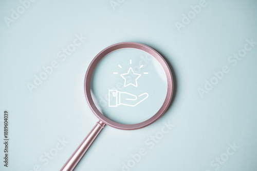 Fotografía Minimal concept image of loyalty rewards and redeem points shown through magnifying glass icon with star and hand