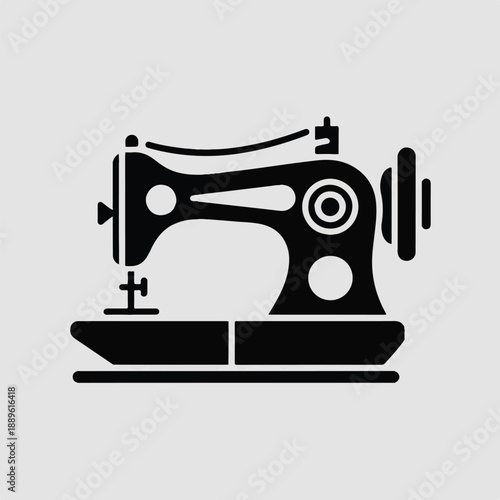 Iconic glyph-style sewing machine in solid black, a sharp and detailed vector graphic for businesses in the garment or craft sector.