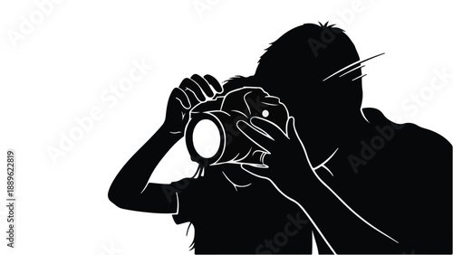 Silhouette of a person holding a camera, capturing a moment with focus and creativity.