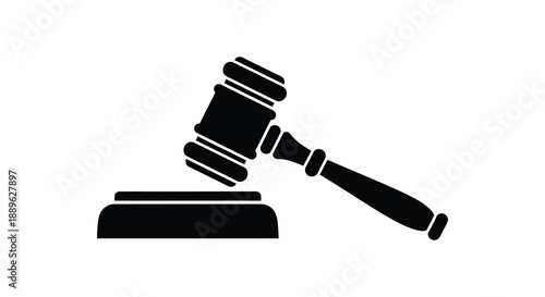 A stark black silhouette depicts a gavel resting on a sound block symbolizing justice and legal proceedings silhouette high quality professional