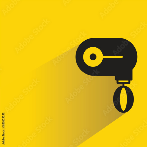 electric whisk icon with shadow on yellow background