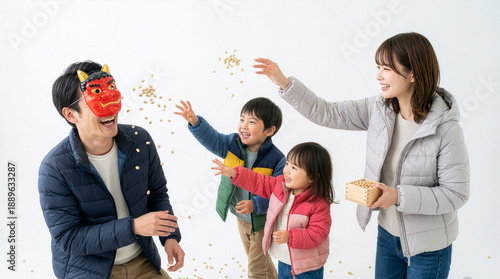 節分で豆まきをする家族