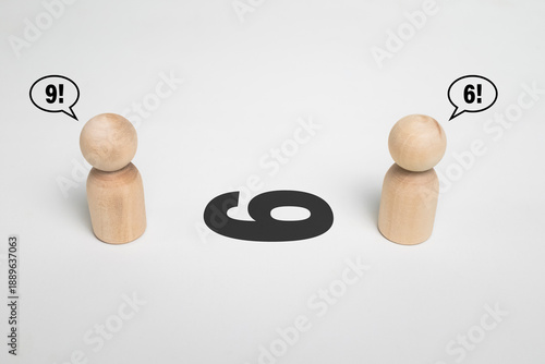 Bild auf Leinwand two wooden figurine arguing number 6 or 9 on white background