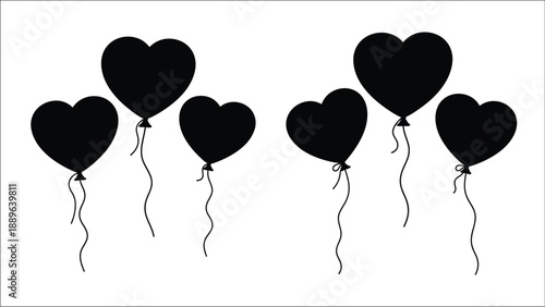 Five black heart shaped balloons floating with strings against a white background