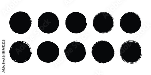 A set of ten distressed black grunge circles with rough brush stroke textures on a white background