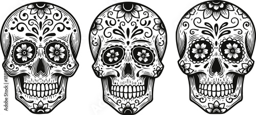Three intricately decorated sugar skulls with floral and ornamental day of the dead designs