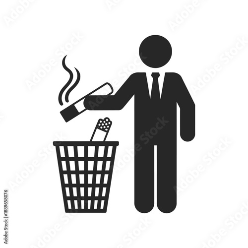A silhouetted businessman discarding a lit cigarette into a wastebasket