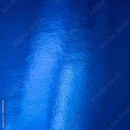 Deep blue abstract background with glossy surface and soft light reflections ...