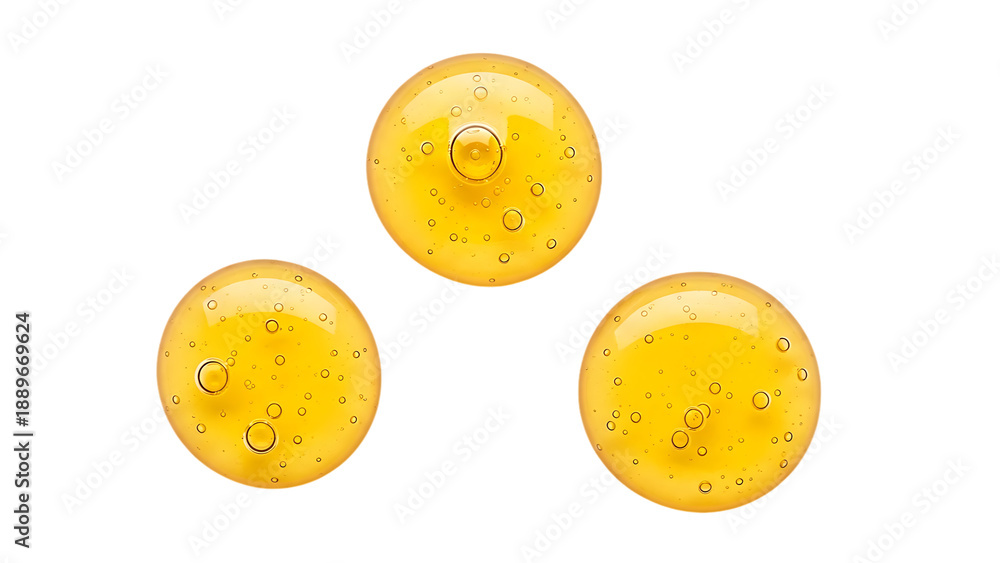 Fototapeta premium Three Golden Serum Drops with Bubbles on Transparent Background