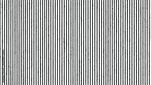 A close-up view of a repeating pattern featuring numerous thin, parallel vertical black and white stripes, creating a textured visual effect.