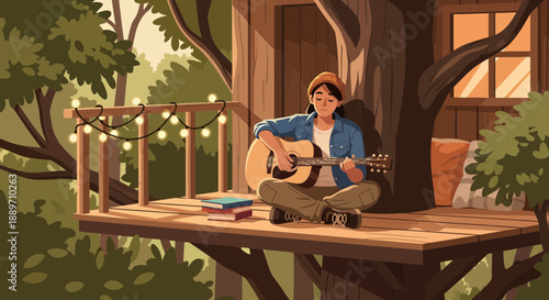 Relaxed woman playing guitar on treehouse deck at sunset