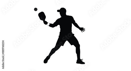 Pickleball player in action preparing to hit the ball silhouette