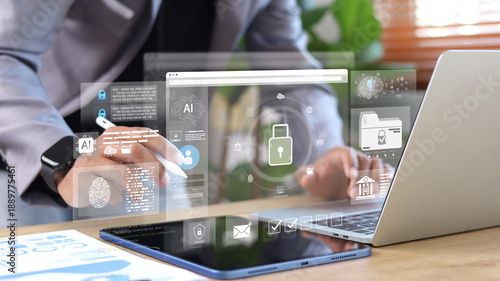 Canvas Print Business professional using tablet and laptop with AI security interface, biometric authentication and data protection