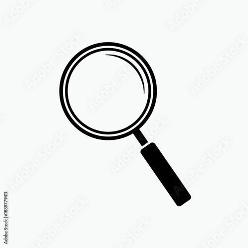 Magnifying glass with black handle.