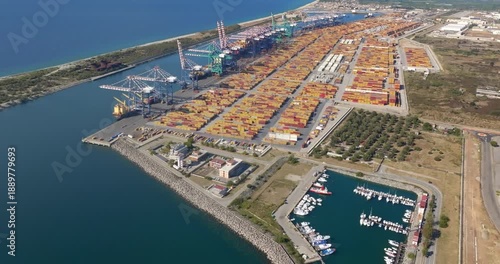 Aerial view of the industrial port of Gioia Tauro, located in the province of Reggio Calabria. It is the largest port in Italy by container throughput and the sixth largest in the Mediterranean Sea.