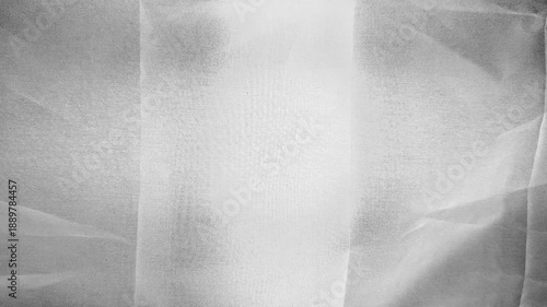 ethereal white tulle fabric softly draping in abstract grayscale texture with subtle folds light gradients and translucent layers