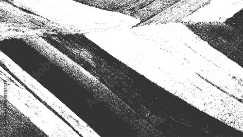 Abstract monochrome textured pattern of diagonal stripes and speckled areas black white