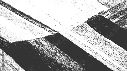 Abstract textured diagonal lines and speckled patterns in black and white