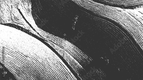 Abstract textured monochrome aerial view of contoured fields and dark shadows