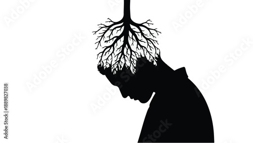 Silhouette of a person with tree roots growing from their head symbolizing growth and ideas